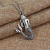 Silver skull pendant necklace featuring a mermaid tail design on a leather cord.