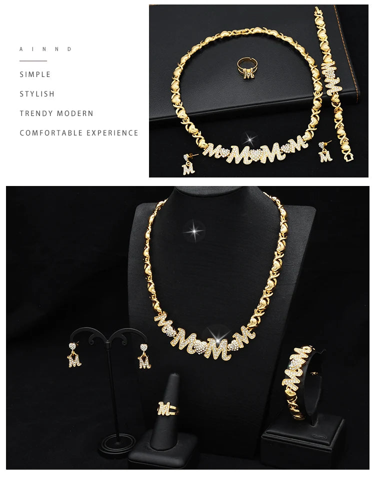 A set of 18K gold heart crystal jewelry including a necklace, earrings, and ring displayed on a black background.