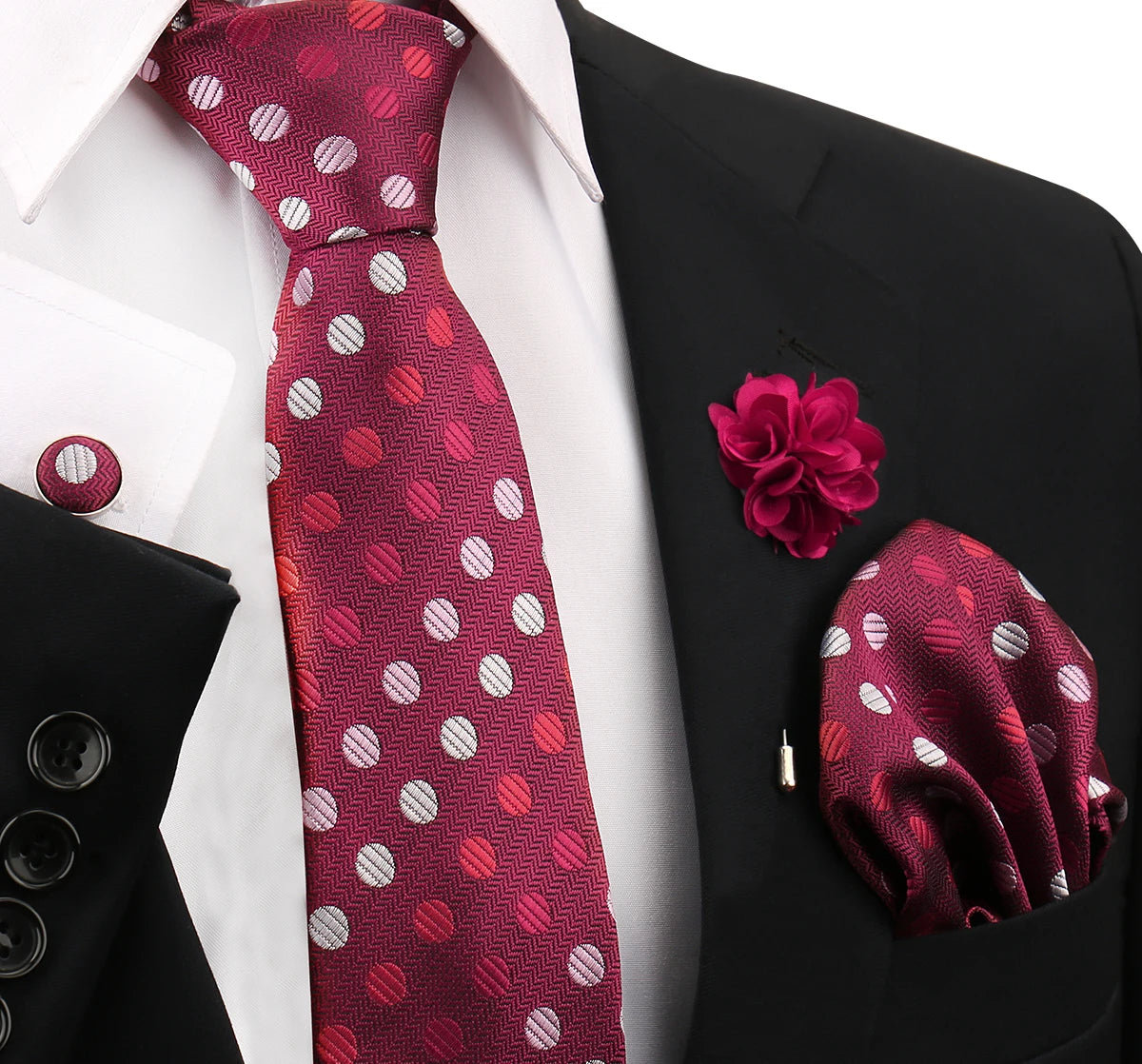 Maroon polka dot tie and matching silk scarf displayed against a black suit jacket and white shirt.