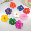 A set of delicate floral hair clips in various vibrant colors including orange, blue, purple, red, yellow, pink, and green.