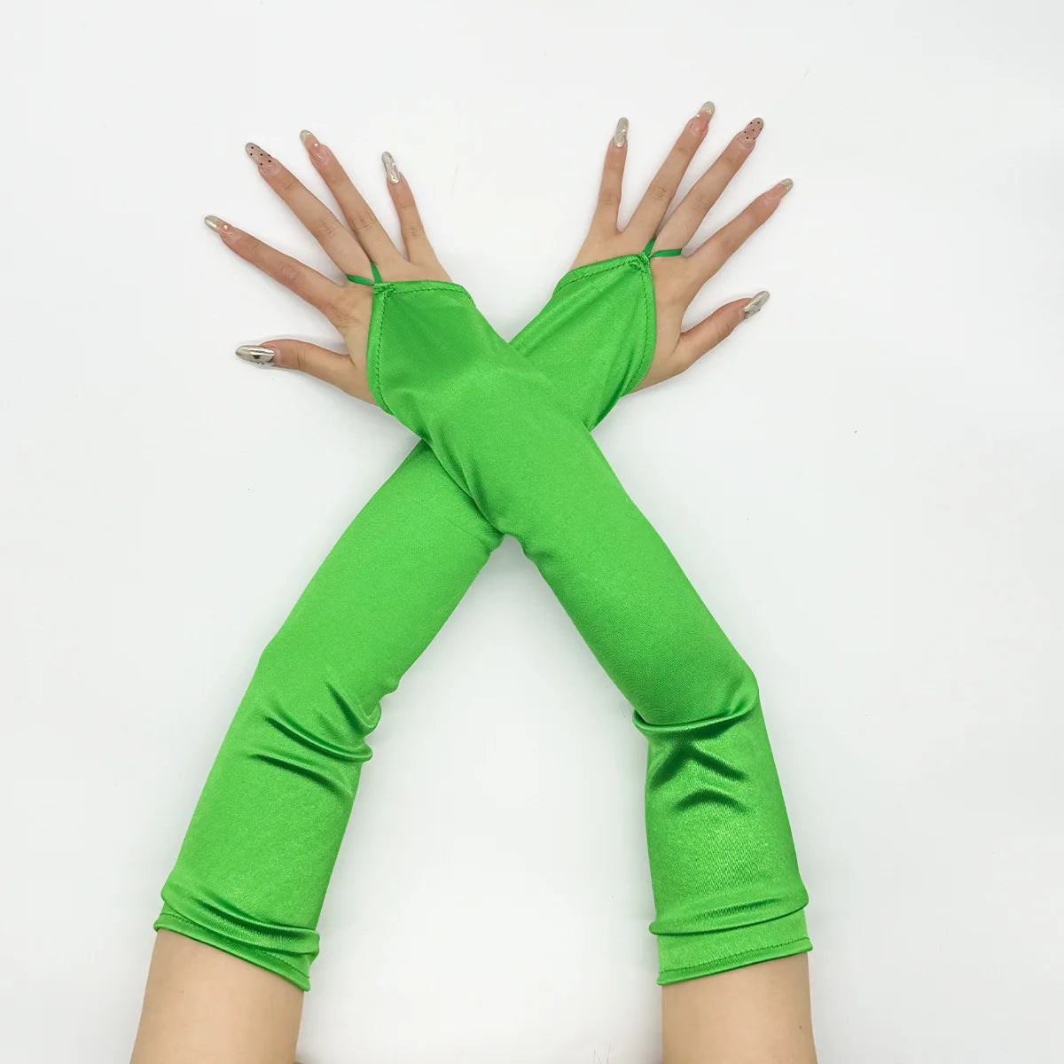 A pair of bright green satin fingerless gloves crossed in an 'X' shape.