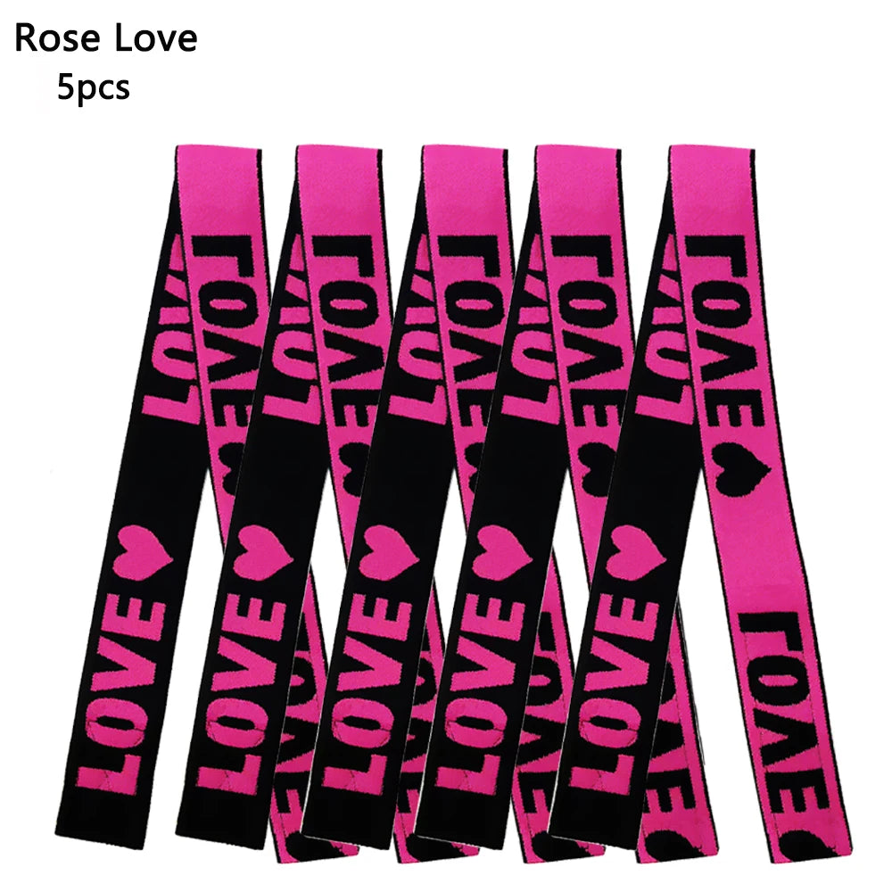 A pack of five bright pink lace love headbands for wigs and scarves.