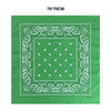 A green cotton bandana scarf with white paisley embroidery and a central square pattern.