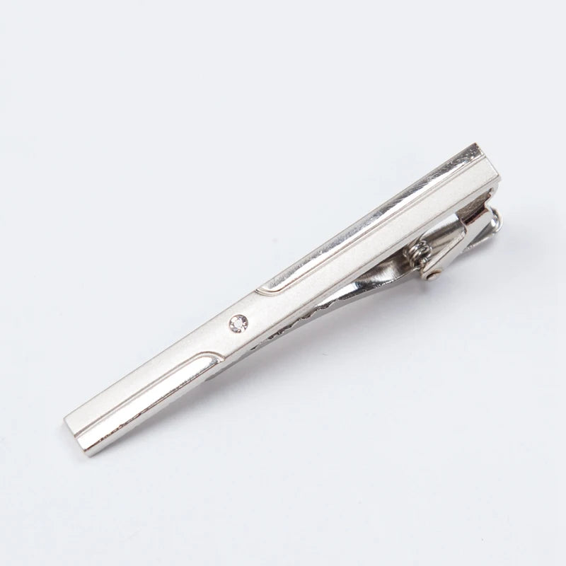 Silver metal tie clip for men's neckties shown in a close-up view.