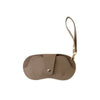 A tan PU leather eyewear storage case with a strap, shown from above.