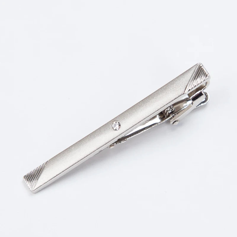 Silver metal tie clip for men's neckties with a textured finish.