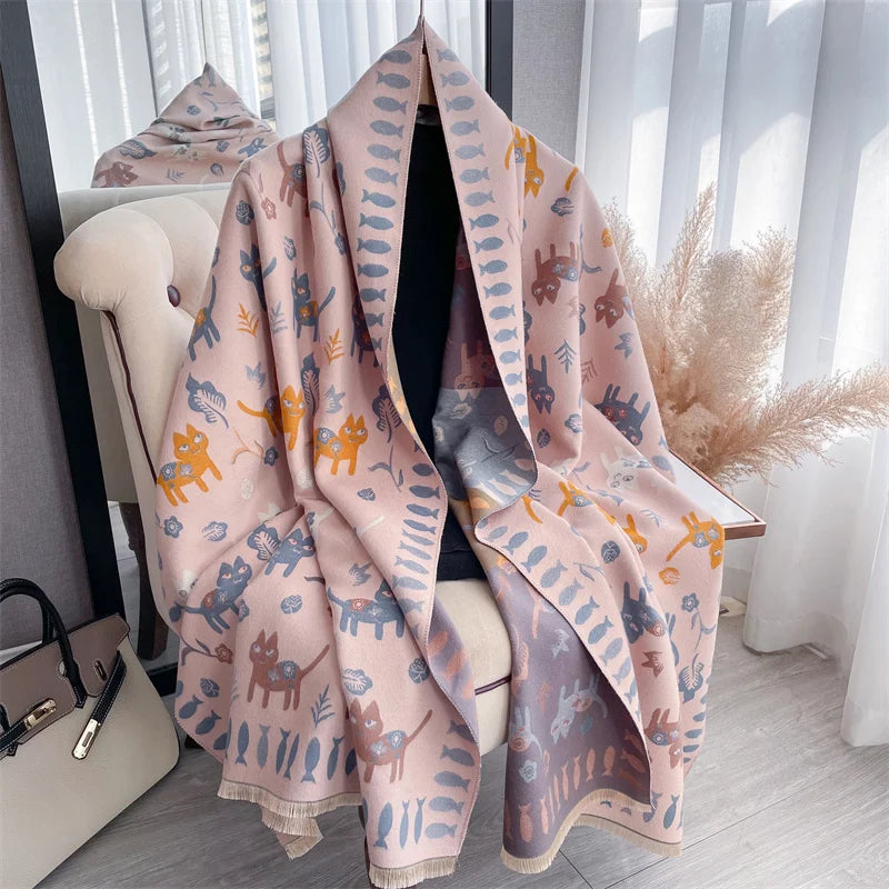 A pink and blue plaid cashmere feel scarf and shawl wrap draped in a bright indoor setting.
