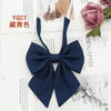 A dark navy blue solid cotton bow tie shown against a white background.