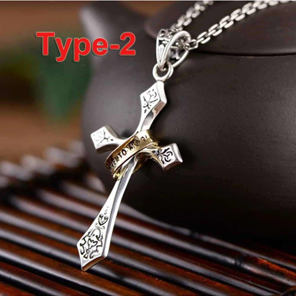 A silver stainless steel crown cross necklace displayed on a wooden surface.