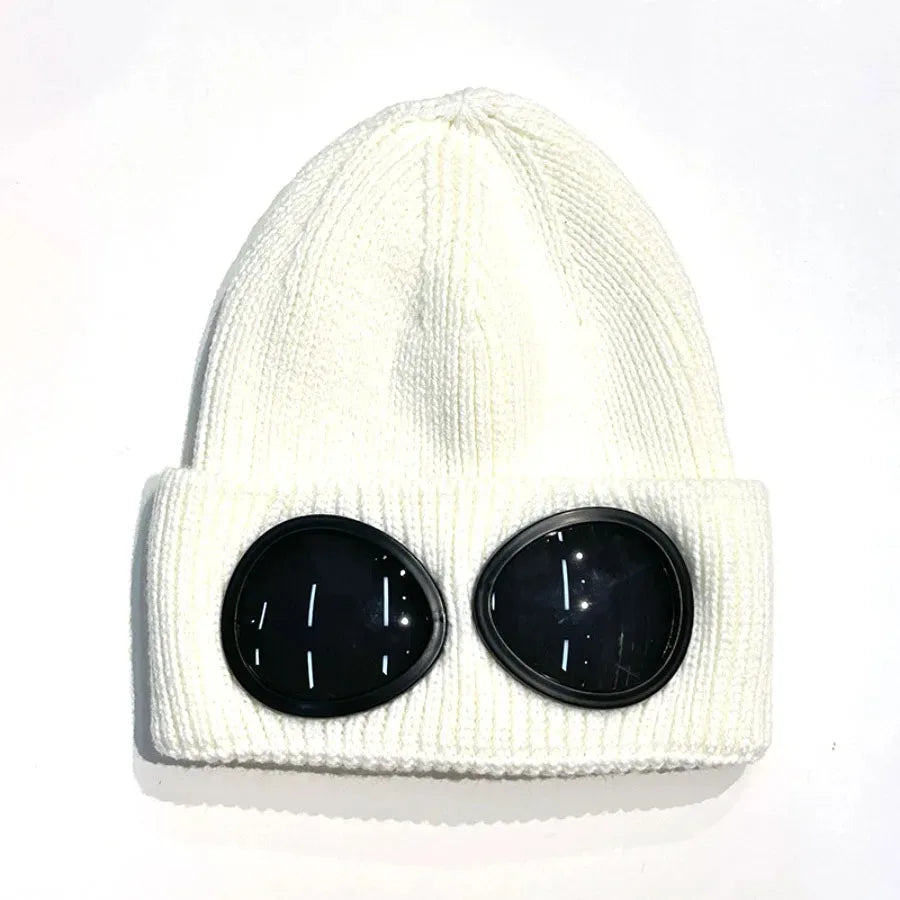 A white knit windproof hat with black round sunglasses attached to the front.