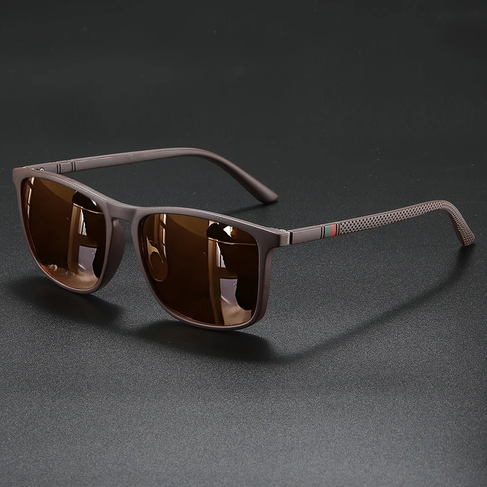 Brown vintage square polarized cycling sunglasses resting on a dark surface.