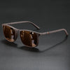 Brown vintage square polarized cycling sunglasses resting on a dark surface.