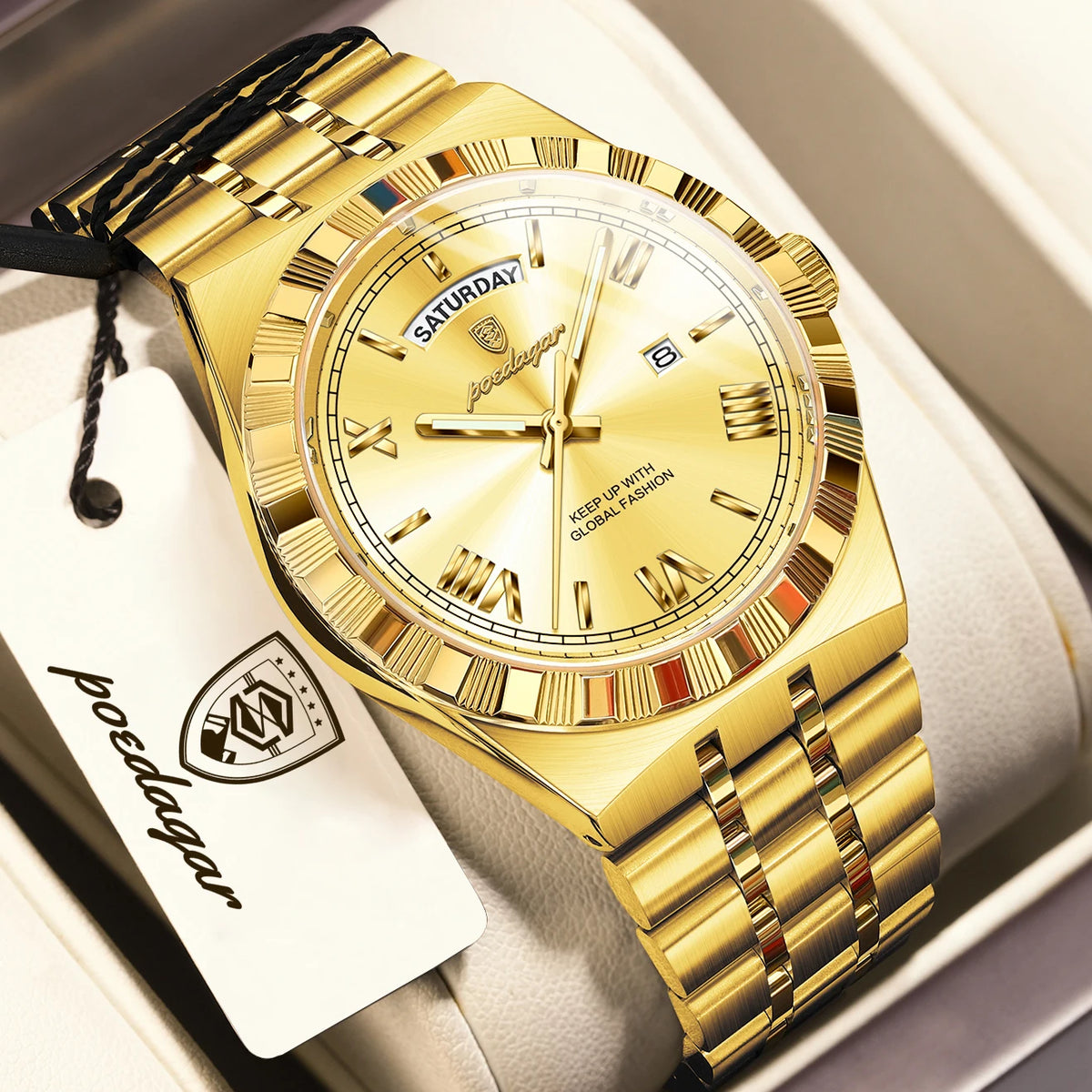 A gold-toned men's watch with a leather strap and a silver-toned case is displayed in a box.