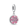 A silver family tree charm necklace with a round pink gemstone engraved with Happy Birthday