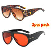A pair of retro oval sunglasses in a leopard print pattern and a pair in solid red color.