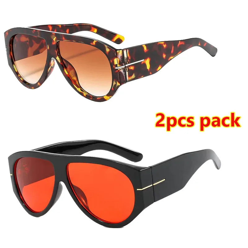 A pair of retro oval sunglasses in a leopard print pattern and a pair in solid red color.