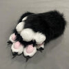 A pair of black and white cartoon cosplay furry gloves with pink accents.