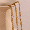 Gold chain bracelet featuring round water drop zircon charms