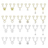 A collection of heart-shaped dangle non-piercing nipple rings with cubic zirconia in gold and silver tones.