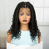 A woman modeling a black box braid wig with light eye makeup and a light blue top.
