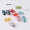 Assortment of ceramic fish charms in various colors and finishes for DIY jewelry making