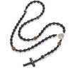 A necklace featuring black obsidian and tiger's eye beads arranged in a cross pendant design.