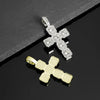 A pair of cross pendant necklaces, one silver and one gold, set against a dark background.