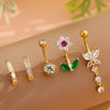 A set of five gold stainless steel dangled belly button rings featuring various gemstone and floral designs.