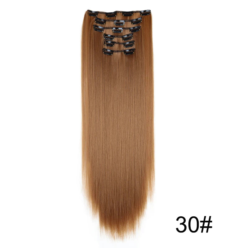 A bundle of long, straight, light brown hair extensions with black hair ties.