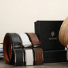 A brown leather belt with a silver buckle and a matching leather strap is displayed next to a book.