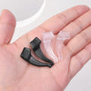A hand holds several clear and black silicone anti-slip ear hooks for eyeglasses.