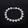 A sparkling heart rhinestone necklace and bracelet set displayed on a black background.