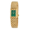 Montre quartz femme plaquée or avec cadran vert et bracelet maillons dorés.