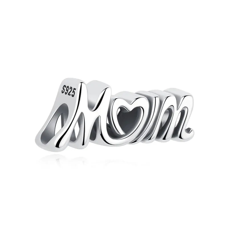 A silver 925 sterling silver family tree charm jewelry piece featuring the initials M & M with a heart design.