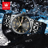 A black stainless steel watch with a gold-toned face and luminous markers is displayed on a dark surface.