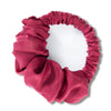 A deep magenta velvet heatless hair curling scrunchie with gathered fabric texture.
