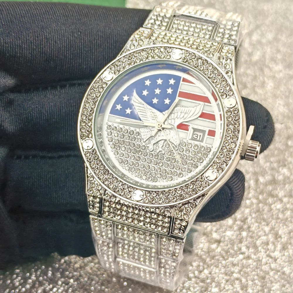A close-up shot of a luxury quartz wristwatch with a silver-toned metal band and diamond accents, featuring an American flag 
