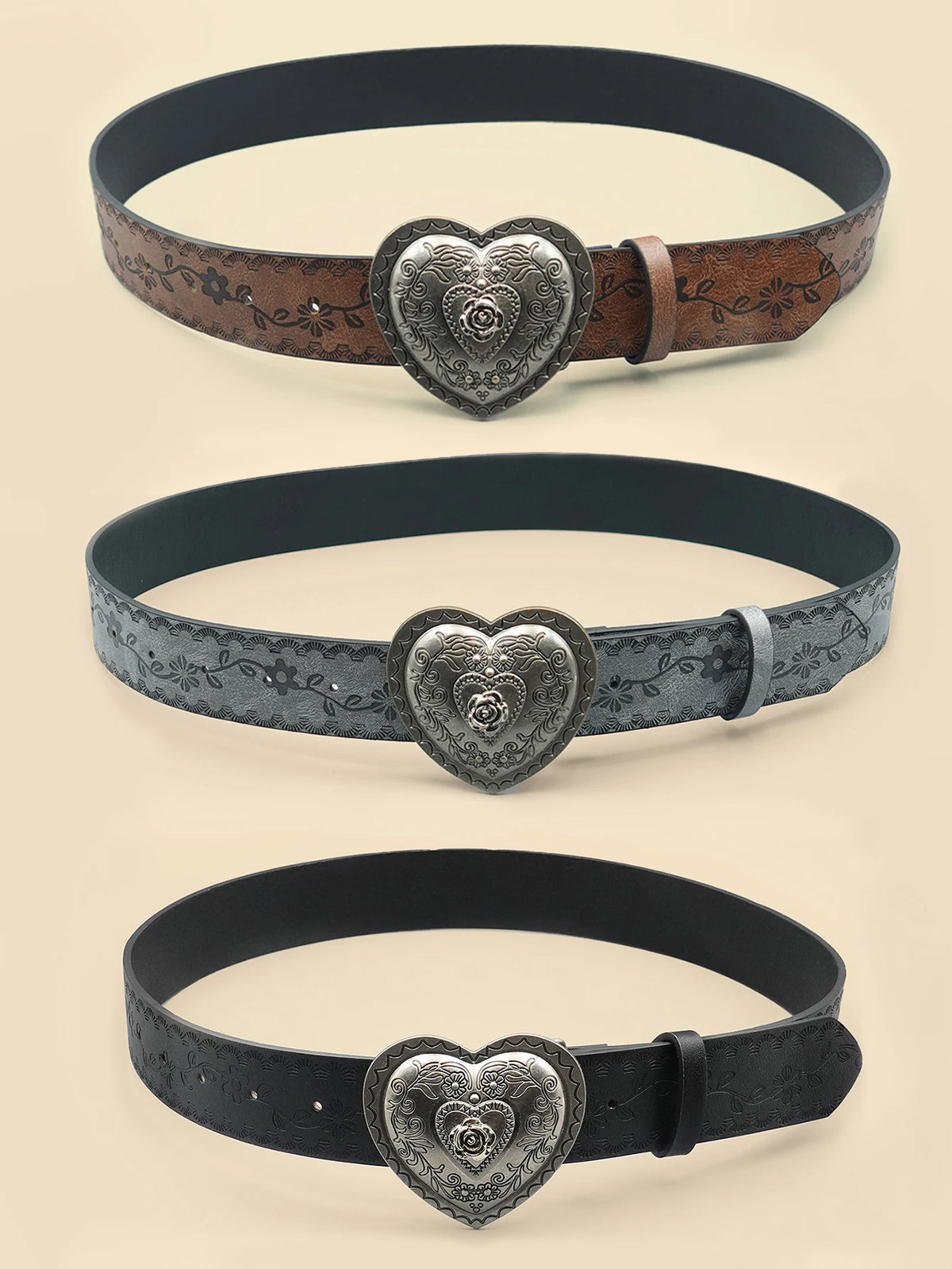 Three heart-shaped retro embossed leather belts in dark brown, gray, and black finishes.