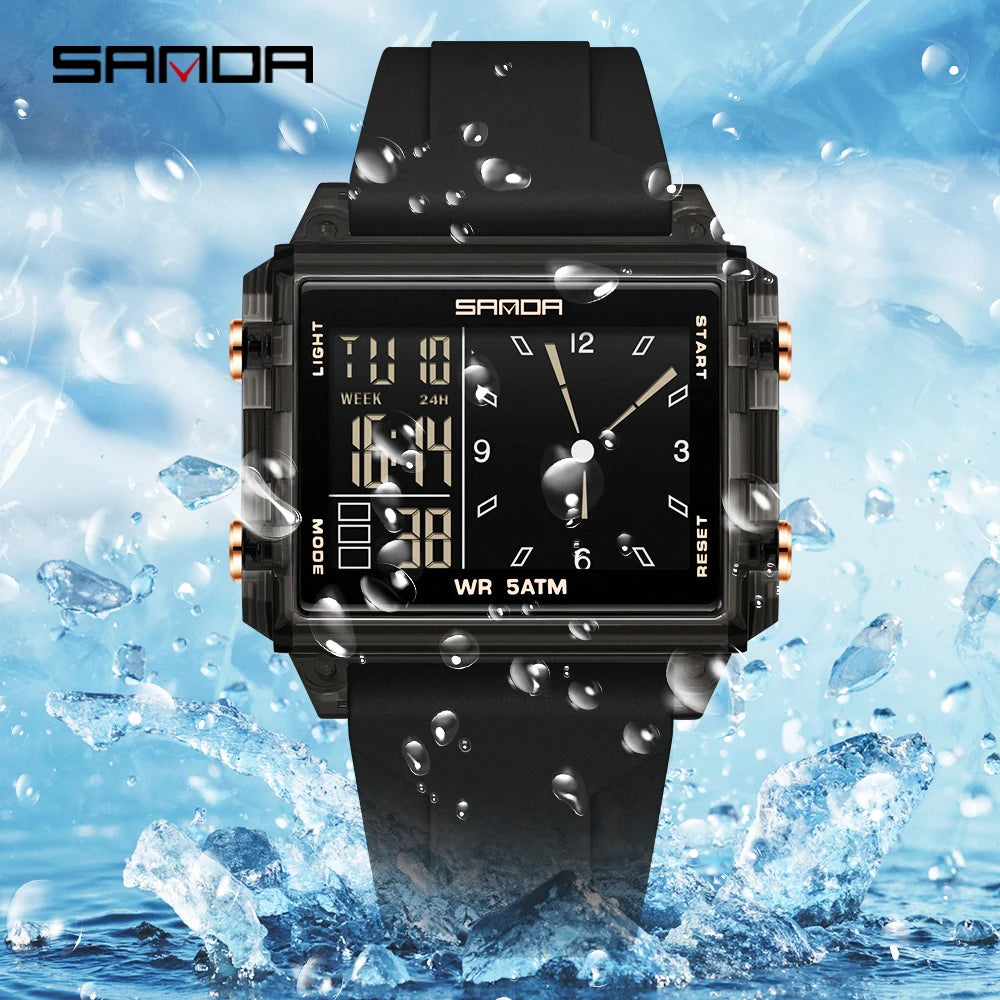 A black digital wristwatch with a luminous display is shown being splashed by water droplets.