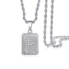 Silver letter F pendant necklace with a chain, featuring an engraved design.