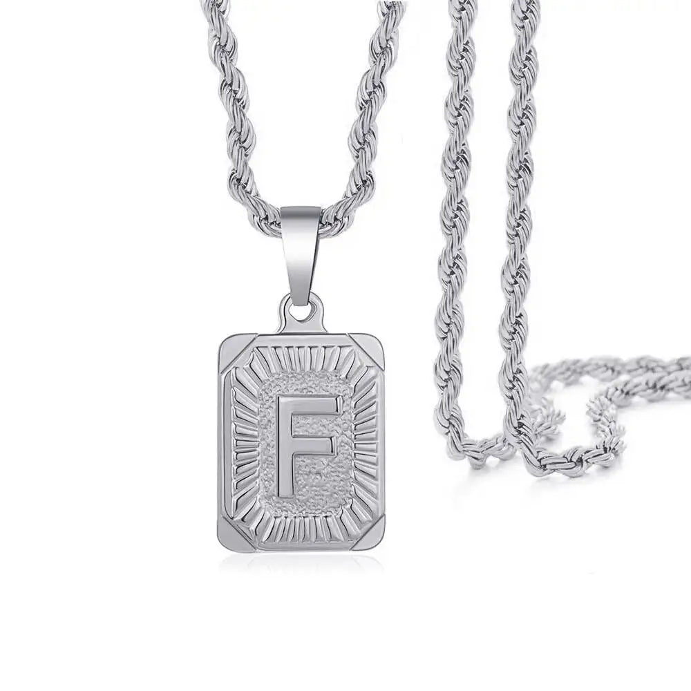 Silver letter F pendant necklace with a chain, featuring an engraved design.