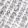 A collection of silver and gemstone charm rings for women displayed on a white background.