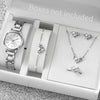 A white box shows an elegant quartz wrist watch, a silver necklace, and diamond earrings.