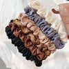 A collection of elegant simulation silk hair ties in various shades including beige, gray, brown, and black.