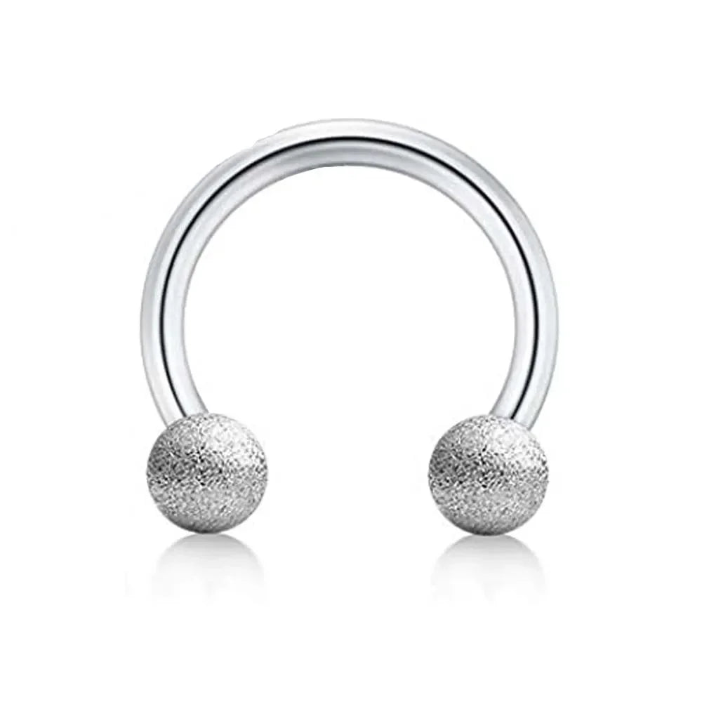 Silver barbell ring set with smooth curved bar and textured ball ends