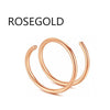 A close-up of a rose gold hoop nose ring jewelry piece.