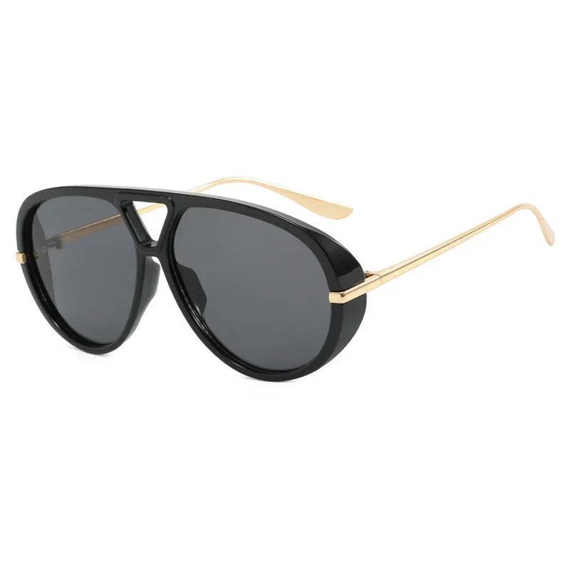 Black aviator style sunglasses with gold-toned arms and lenses