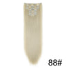 A bundle of long, straight, light blonde hair extensions with decorative silver clips.