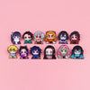 A collection of twelve anime enamel pin brooches featuring various characters and designs arranged in a row on a pink backgro