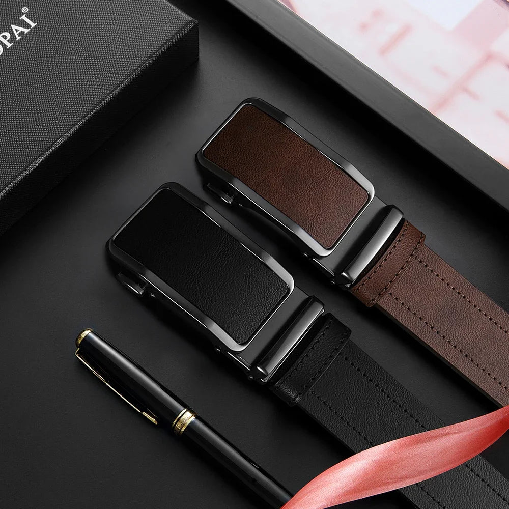 A black leather belt with a brown strap and a silver automatic buckle is displayed on a dark surface.